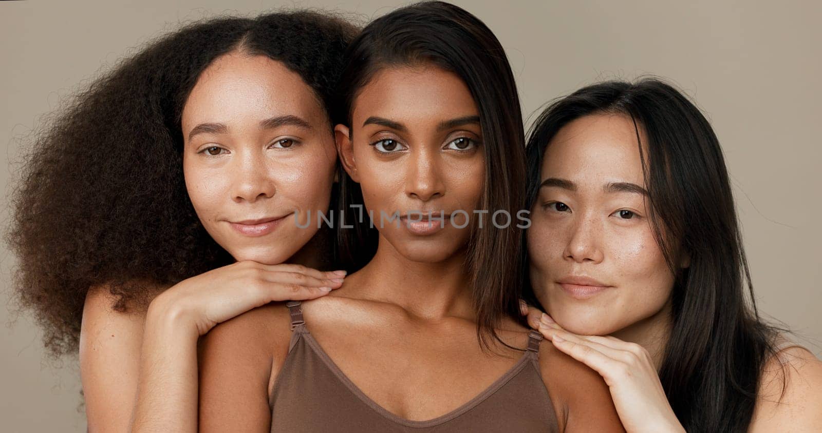 Face, beauty and portrait of women friends in studio for diversity, inclusion or wellness. Model people on neutral background for different skin, facial care and dermatology glow or natural cosmetics by YuriArcurs