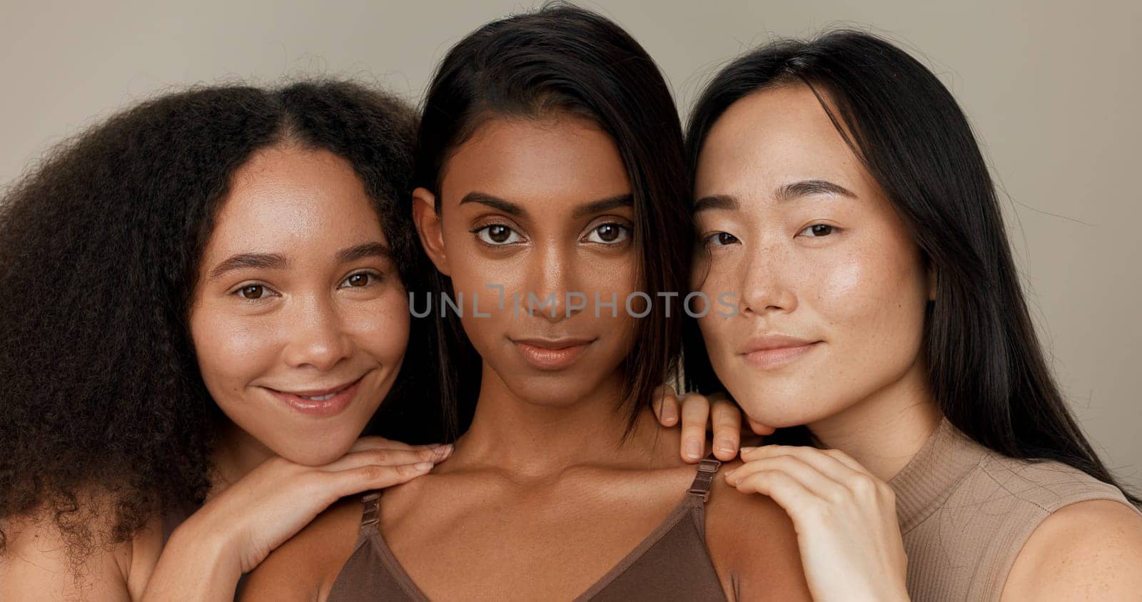 Women, underwear and beauty of diversity friends in studio for portrait, inclusion or wellness. Model people hug on neutral background as different body care, skin glow or natural cosmetic comparison by YuriArcurs