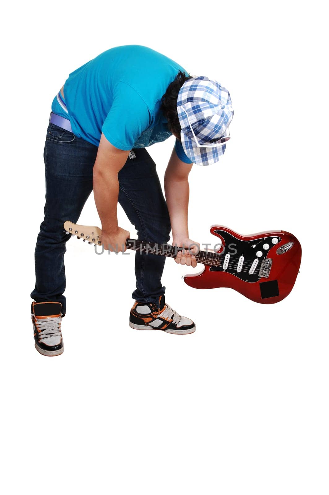 Boy mad at the guitar.