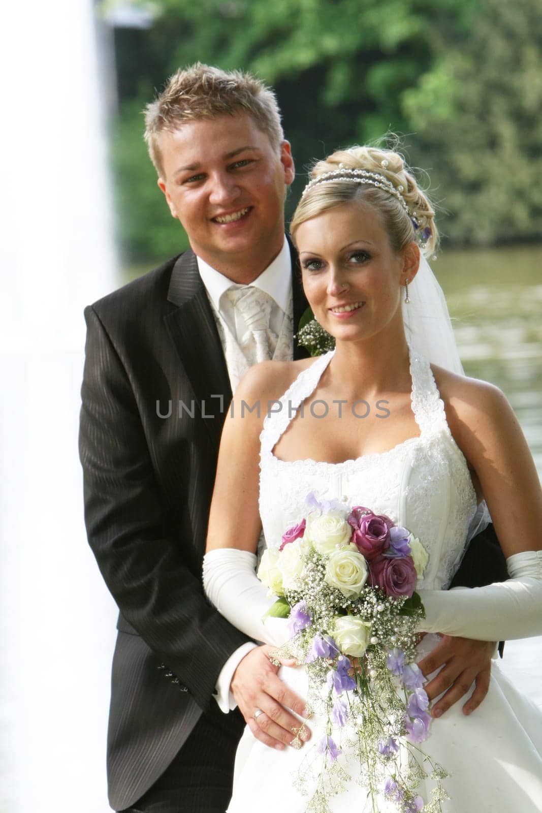 Portrait - young newlyweds - hand in hand