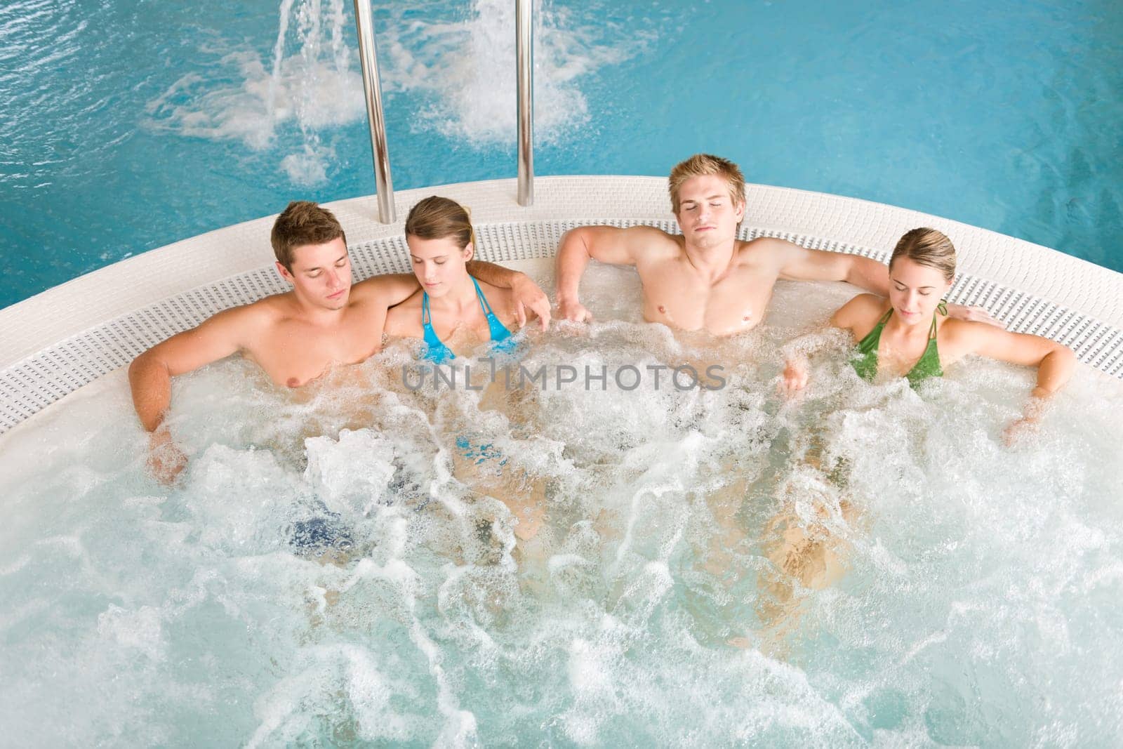 Top view - people relax in hot tub
