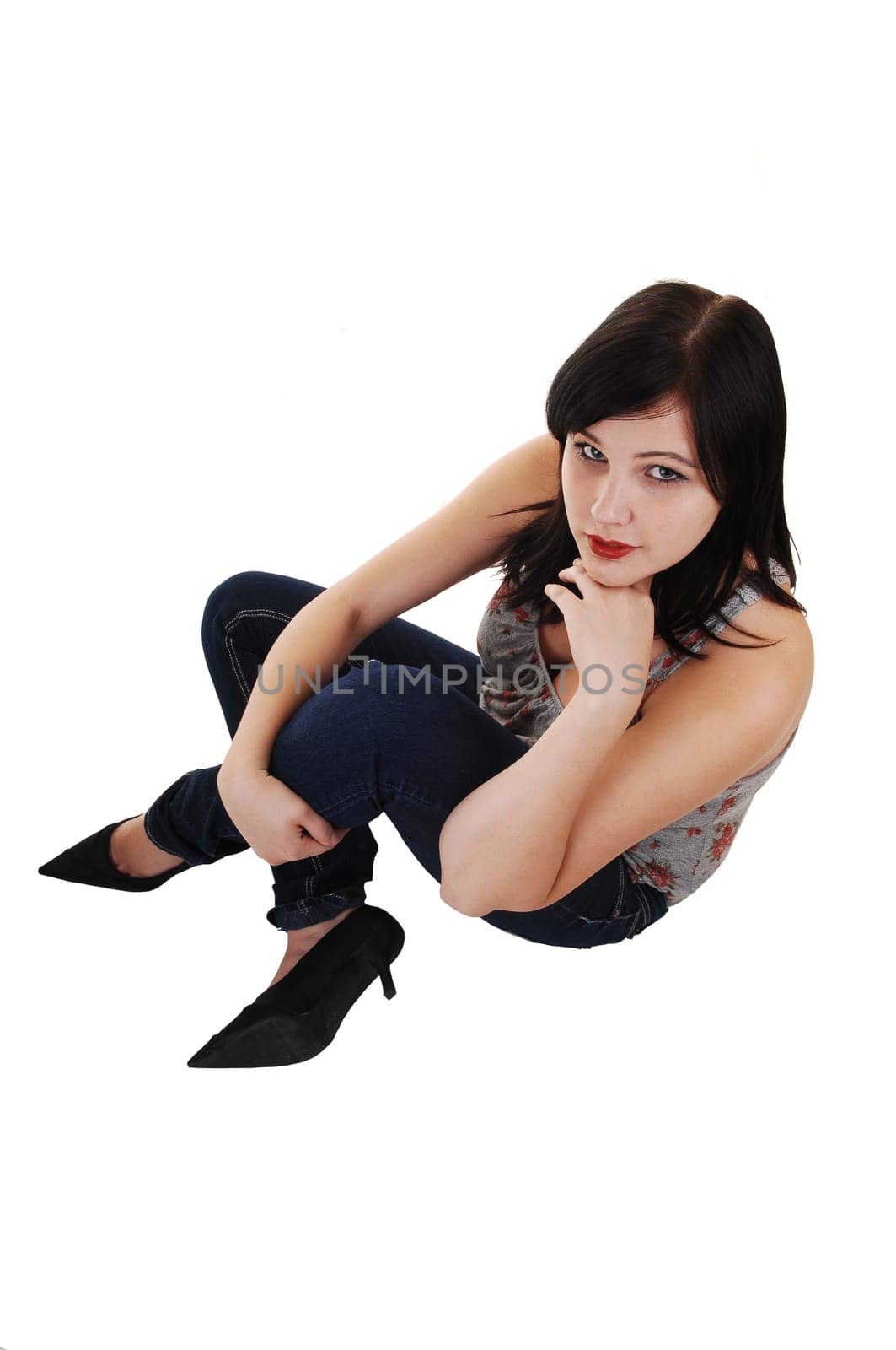 Girl sitting on floor.