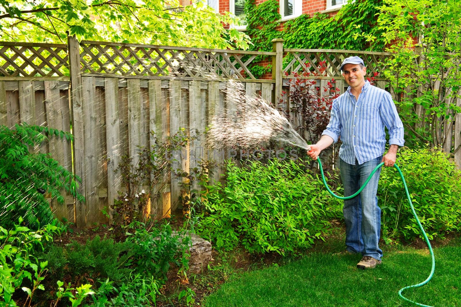 Man watering garden