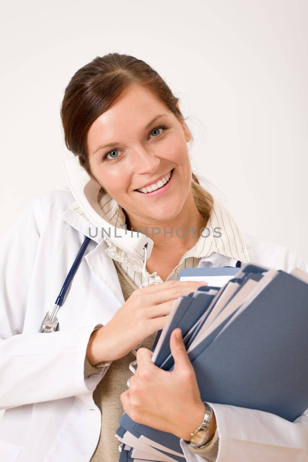 Female doctor on the phone with medical file