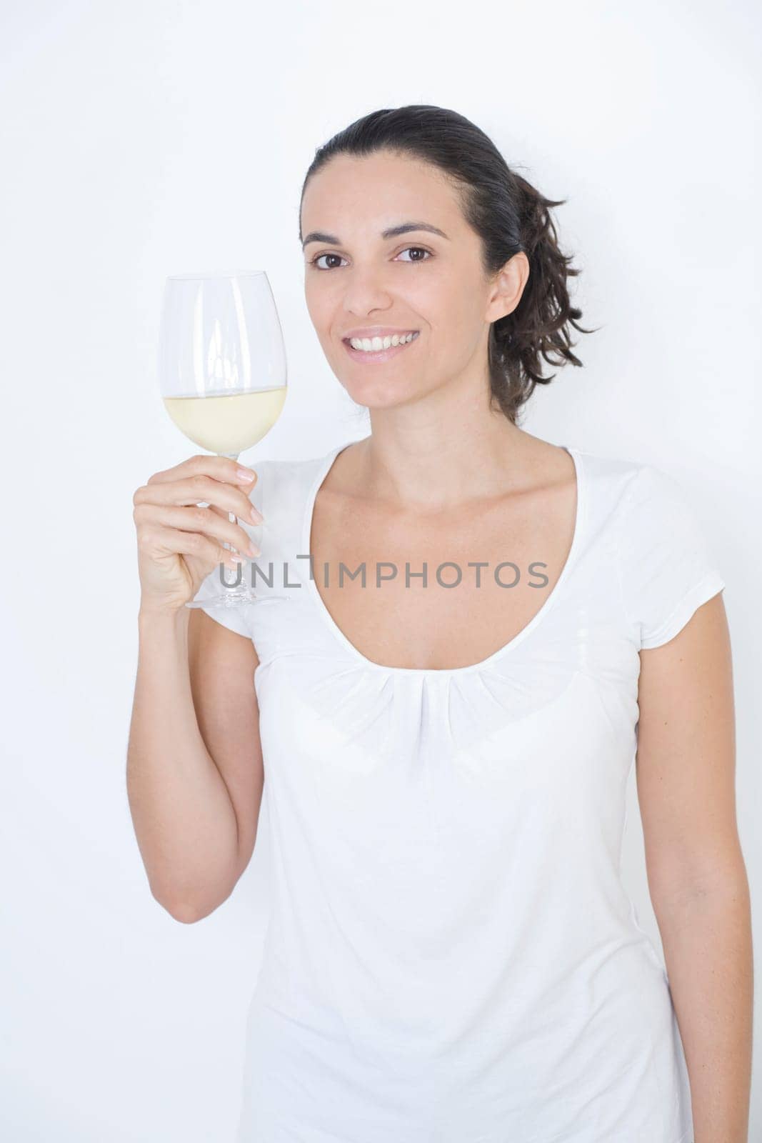 Woman tasting white wine
