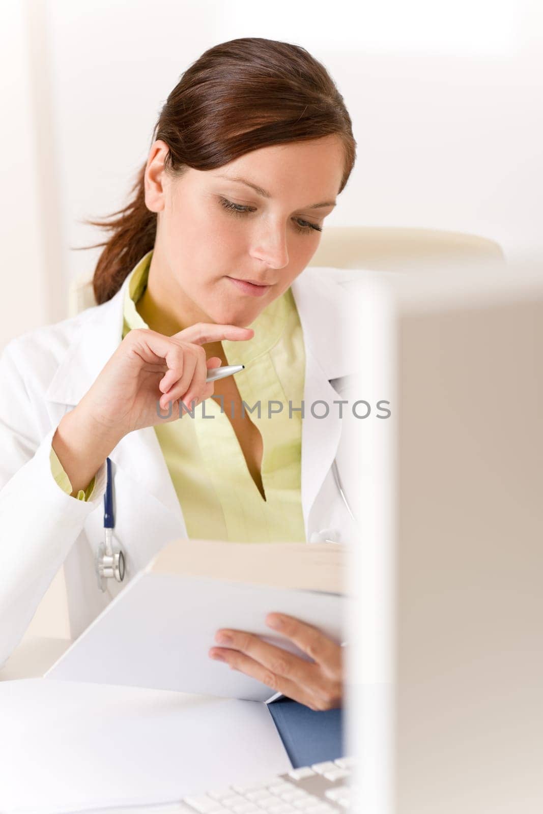 Female doctor read book in clinic
