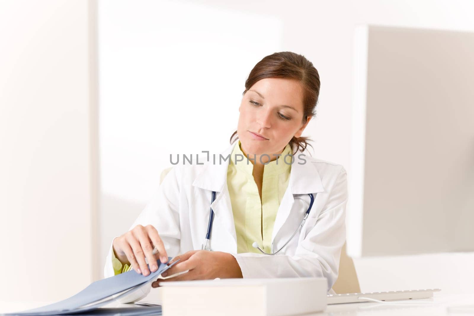 Female doctor at medical office with stethoscope