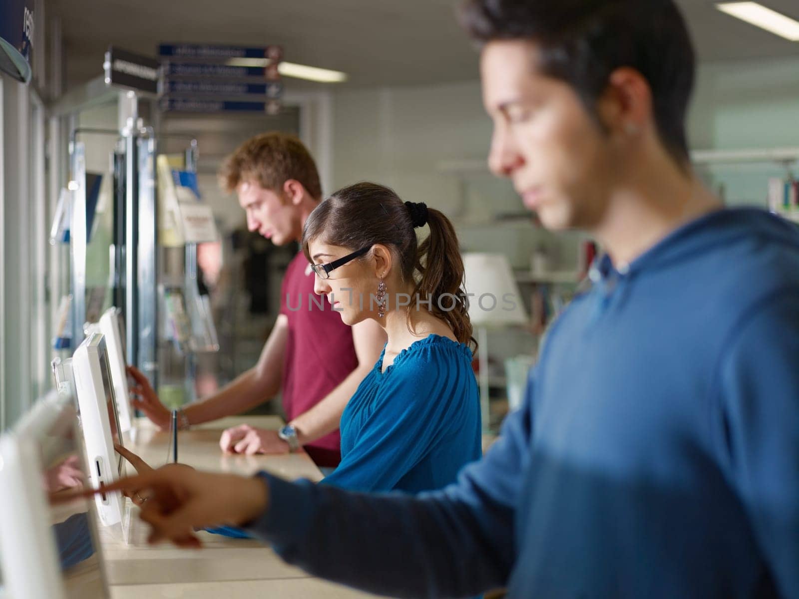students using pc in library