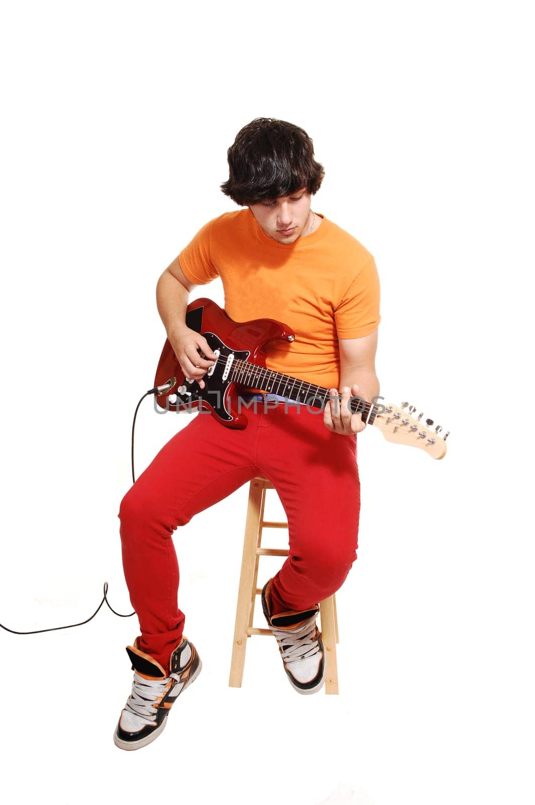 Teen boy with guitar.