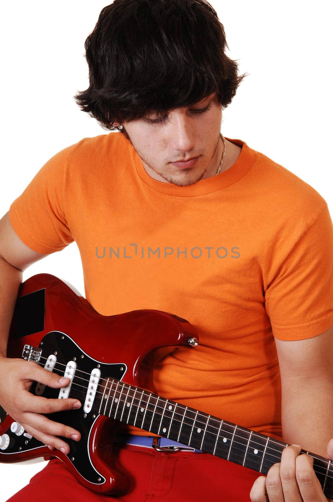 Teen boy with guitar.