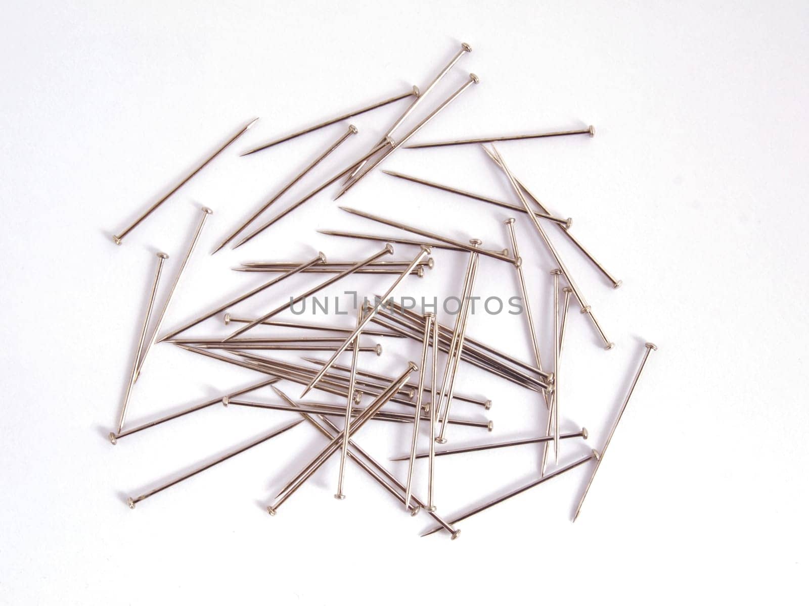 Pin used when sewing on a plain white background.