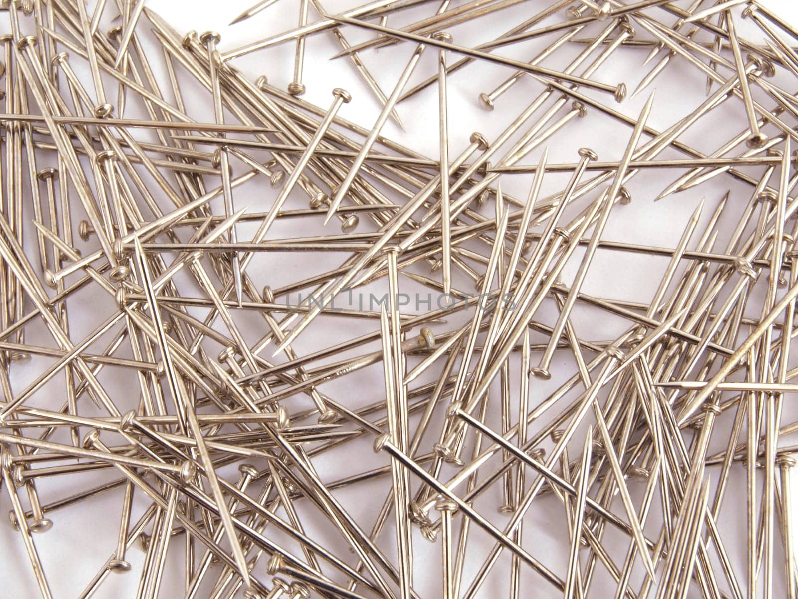 Pin used when sewing on a plain white background.