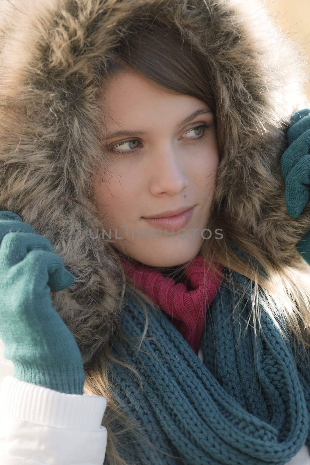 Winter fashion - woman with fur hood outdoors