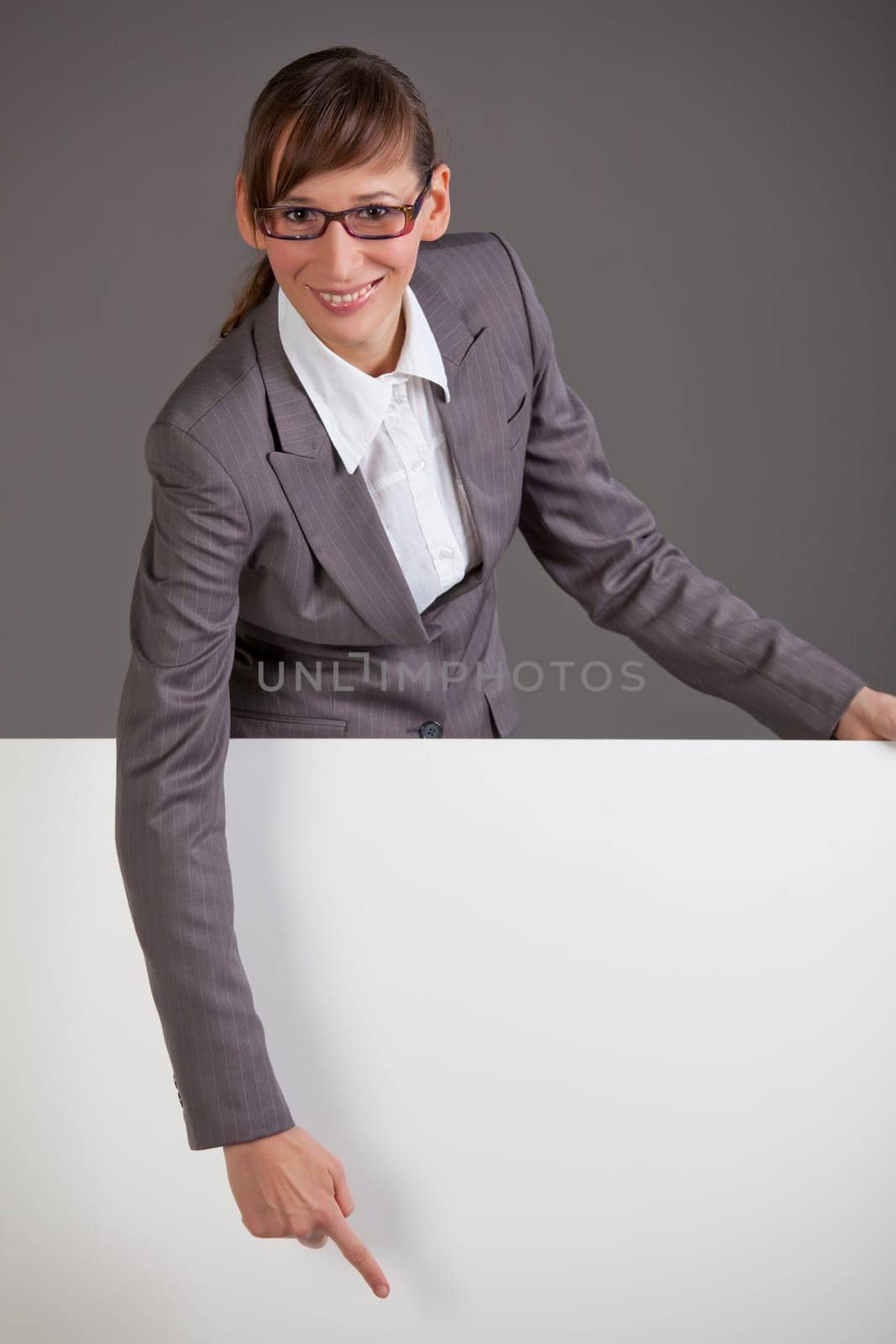 woman pointing on blank board
