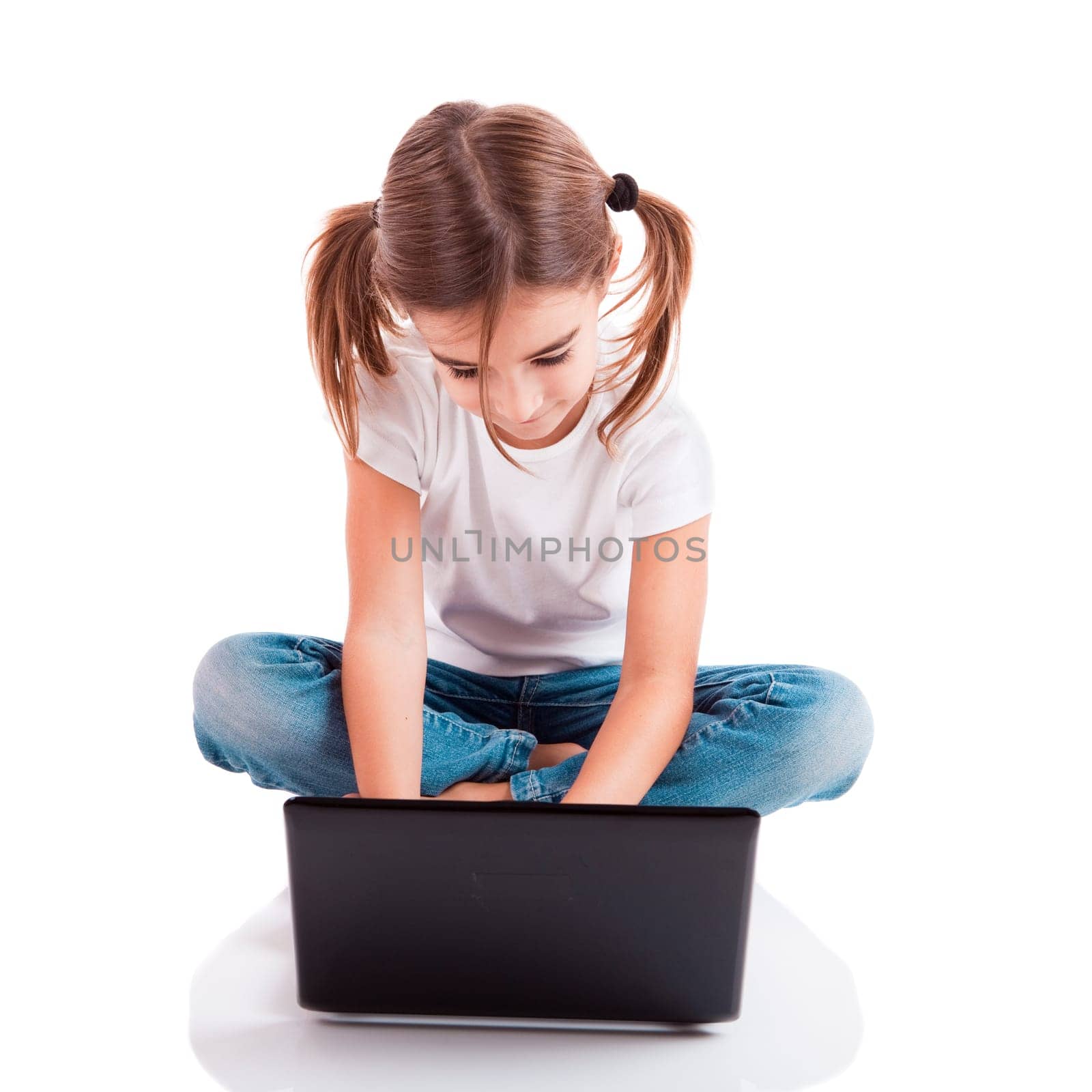 Little student girl with a laptop