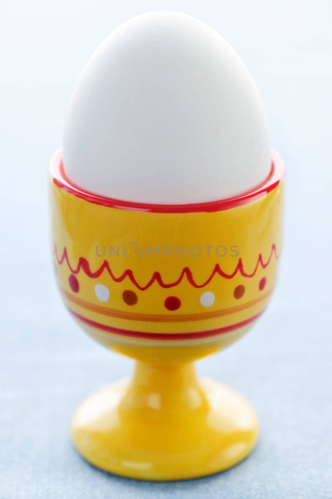 Boiled egg in cup