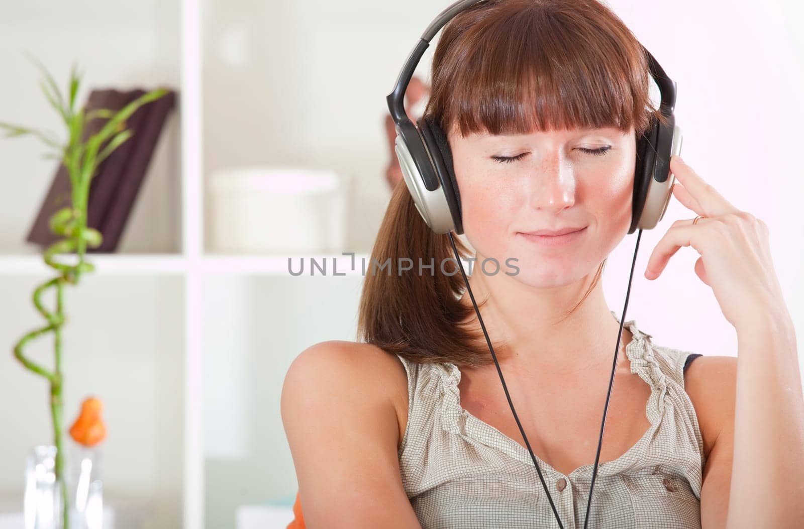 woman hearing music in earphones