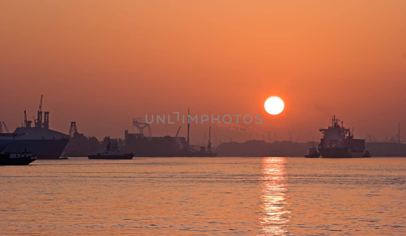 Red sunrise on the foggy river