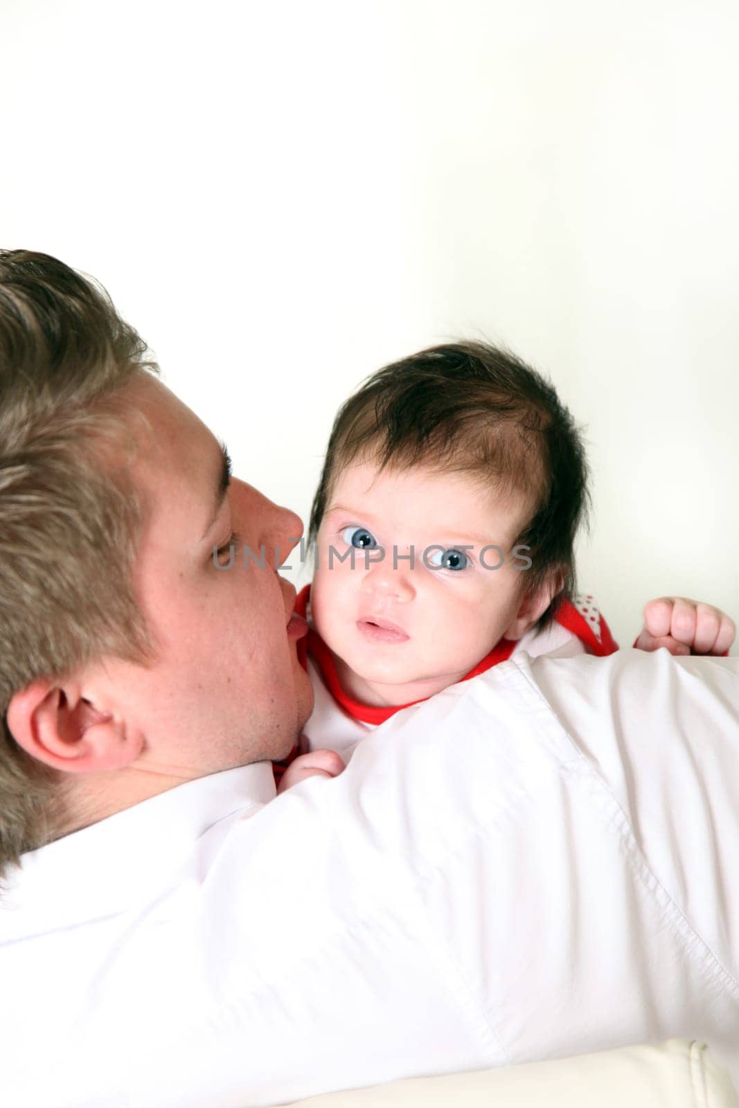 father carries his baby