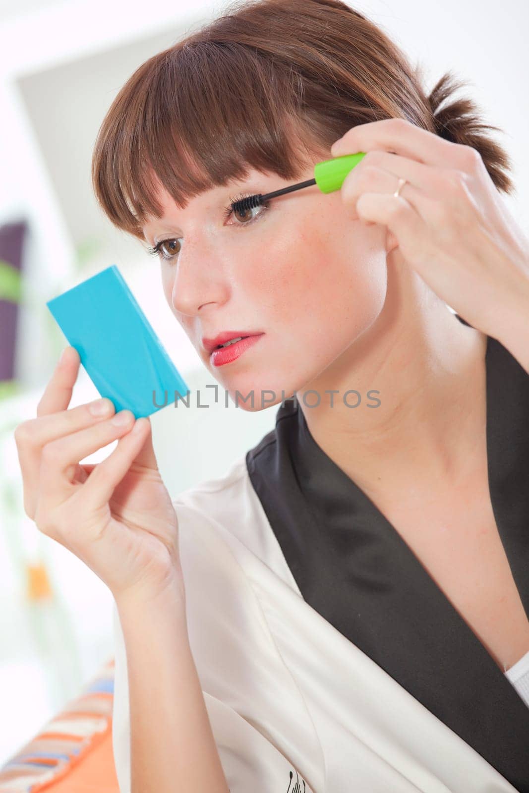 woman putting make up for eye