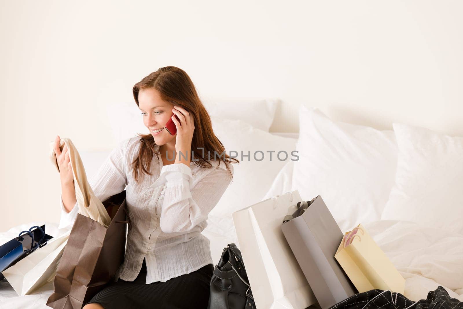 Woman on phone - back home from shopping