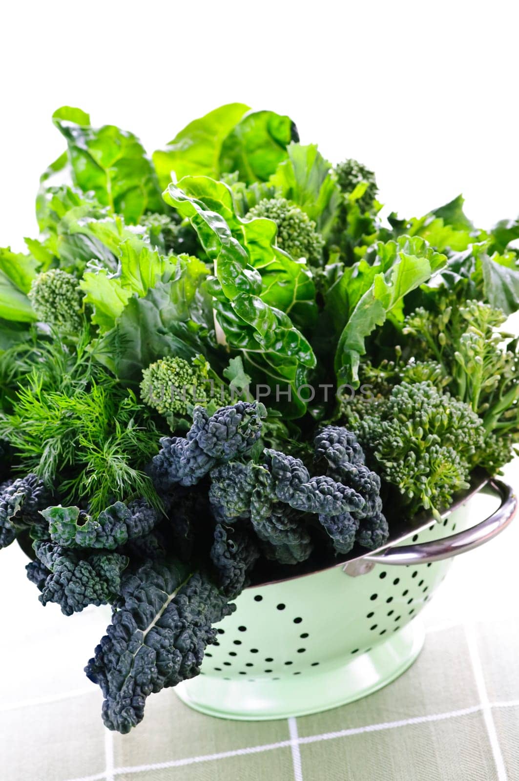 Dark green leafy vegetables in colander