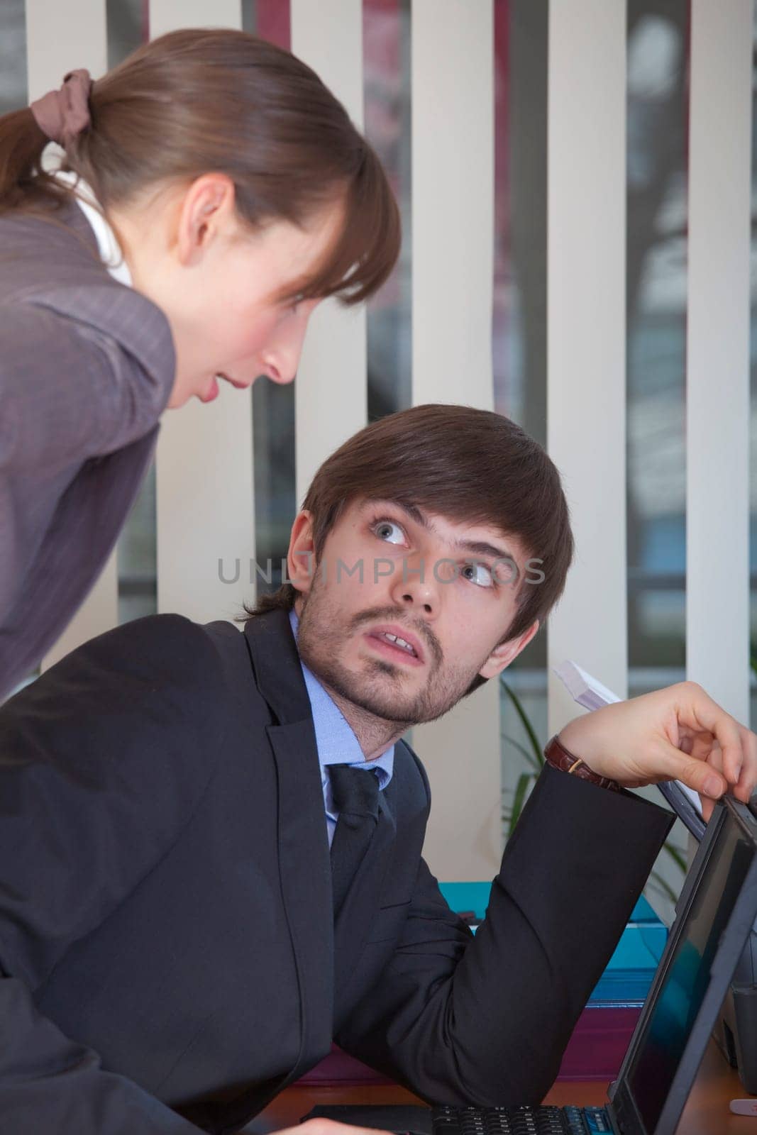 man surprised by woman at work