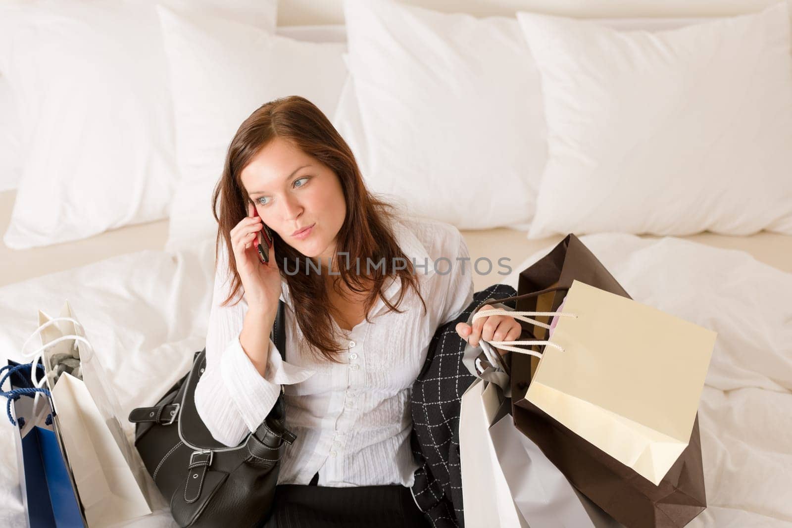 Woman on phone - back home from shopping