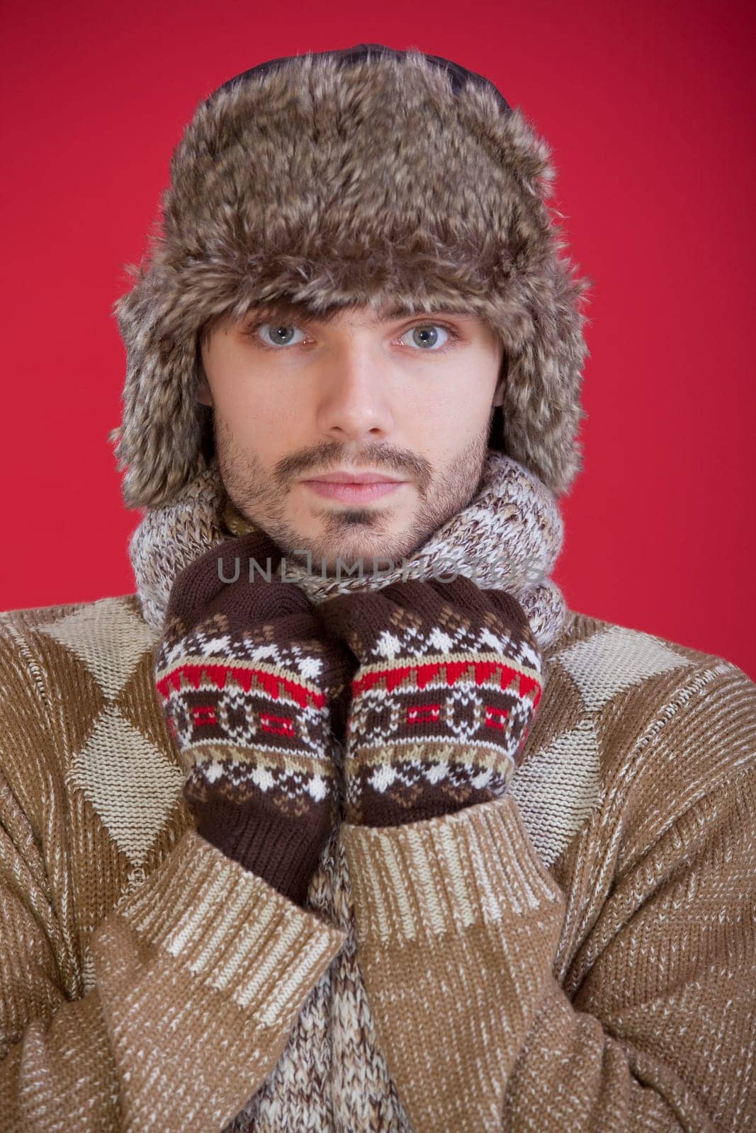 man in fur hat and sweater