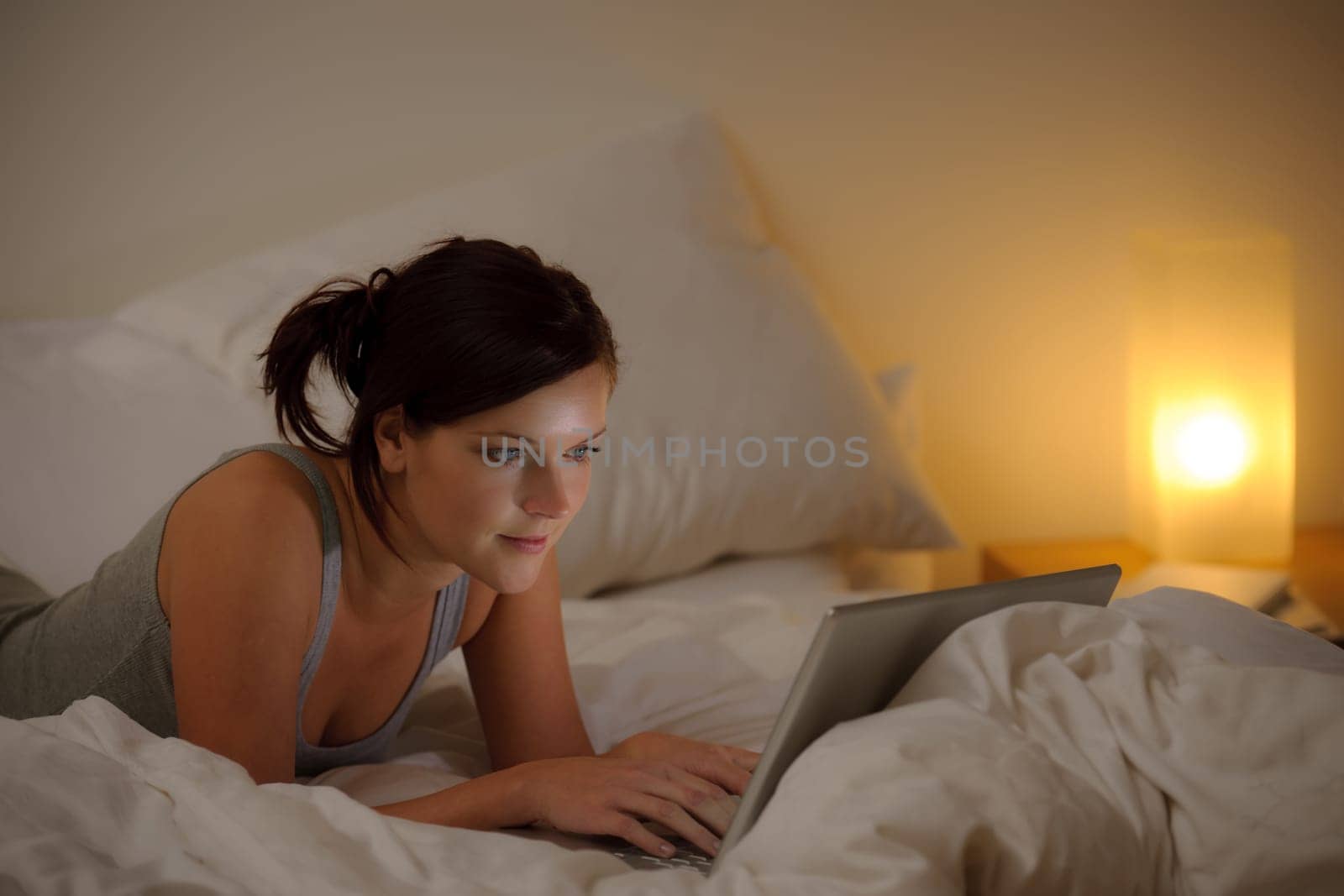 Bedroom evening - woman with laptop