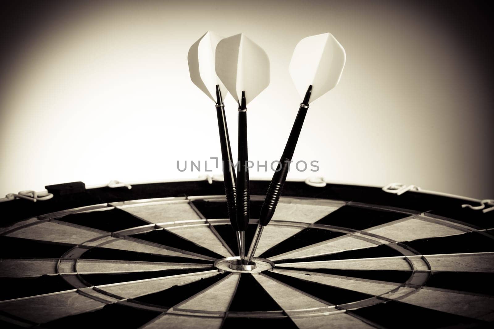Perspective Photo Of Three Arrows On Darts Table