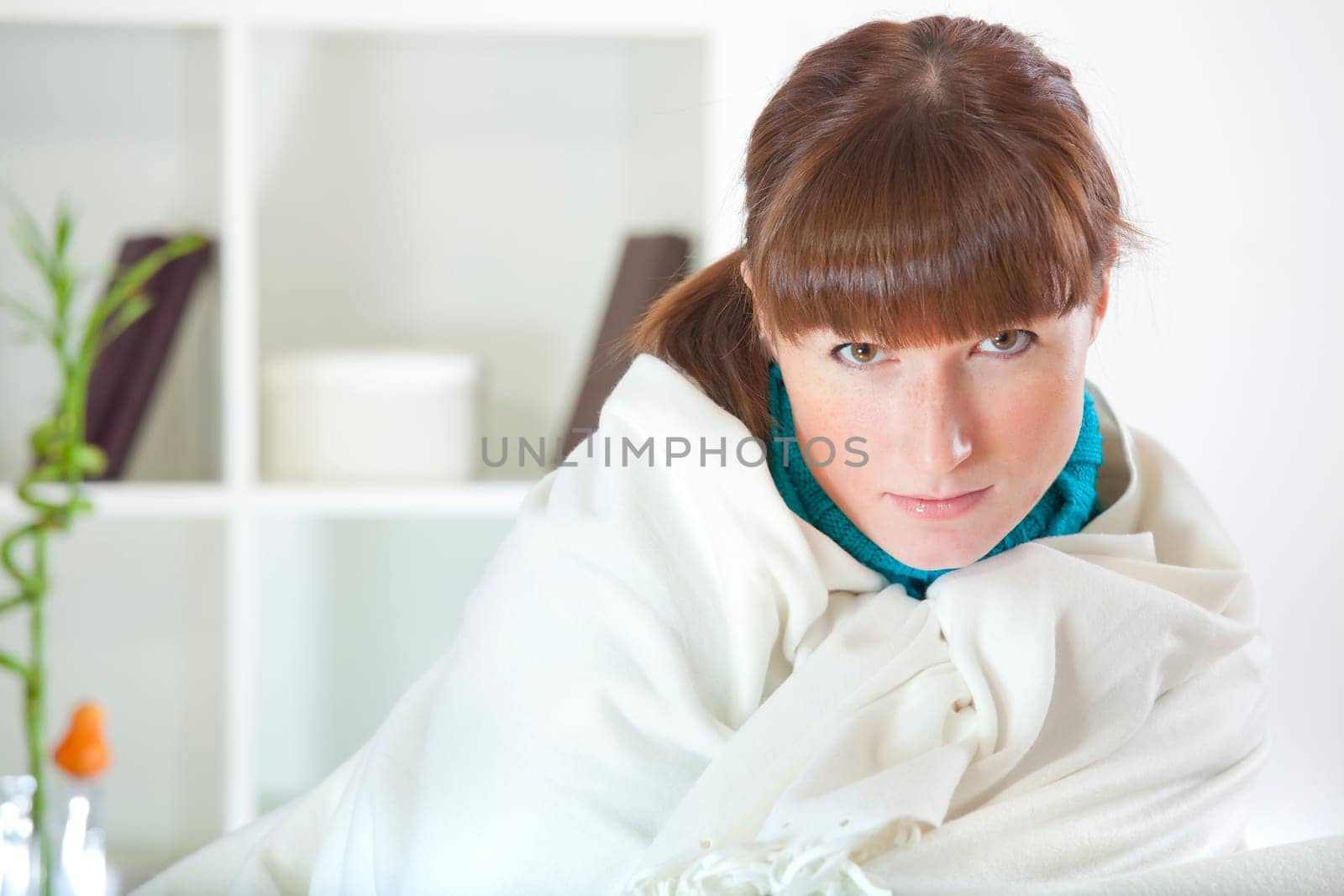 woman resting on sofa