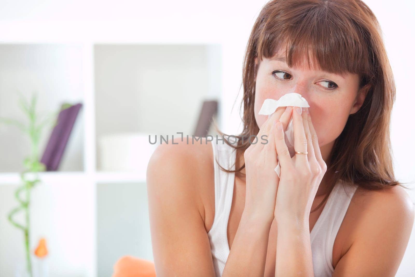 woman sneezing