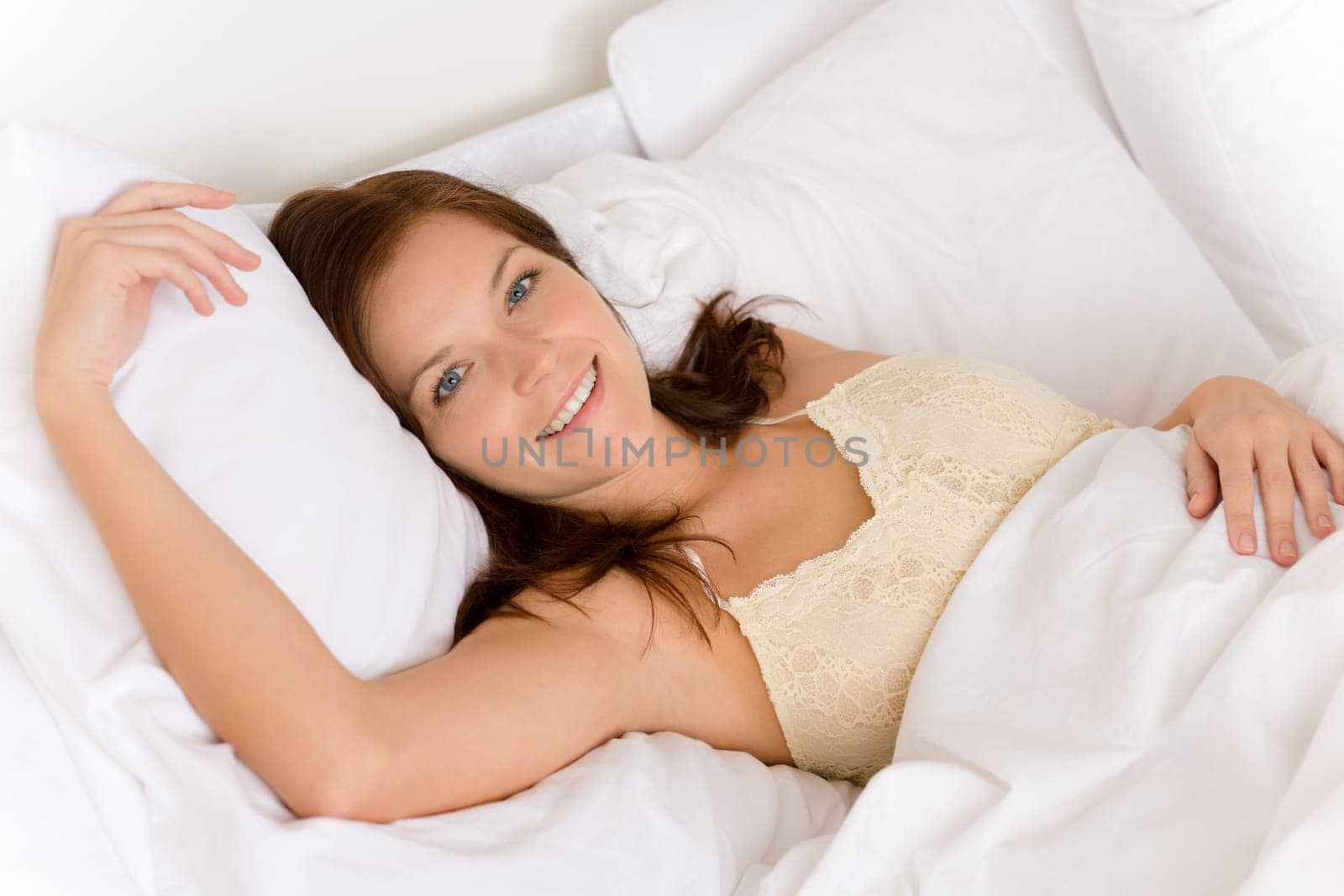 Bedroom - happy woman in white bed