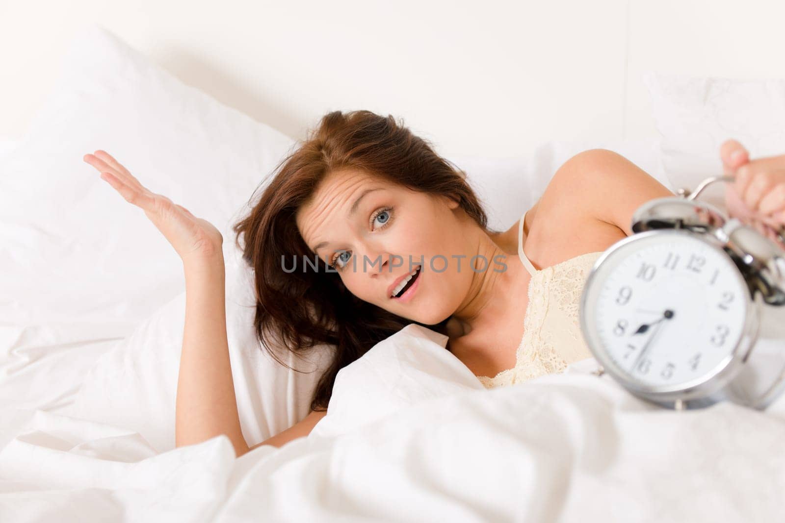 Bedroom - woman with alarm clock wake up