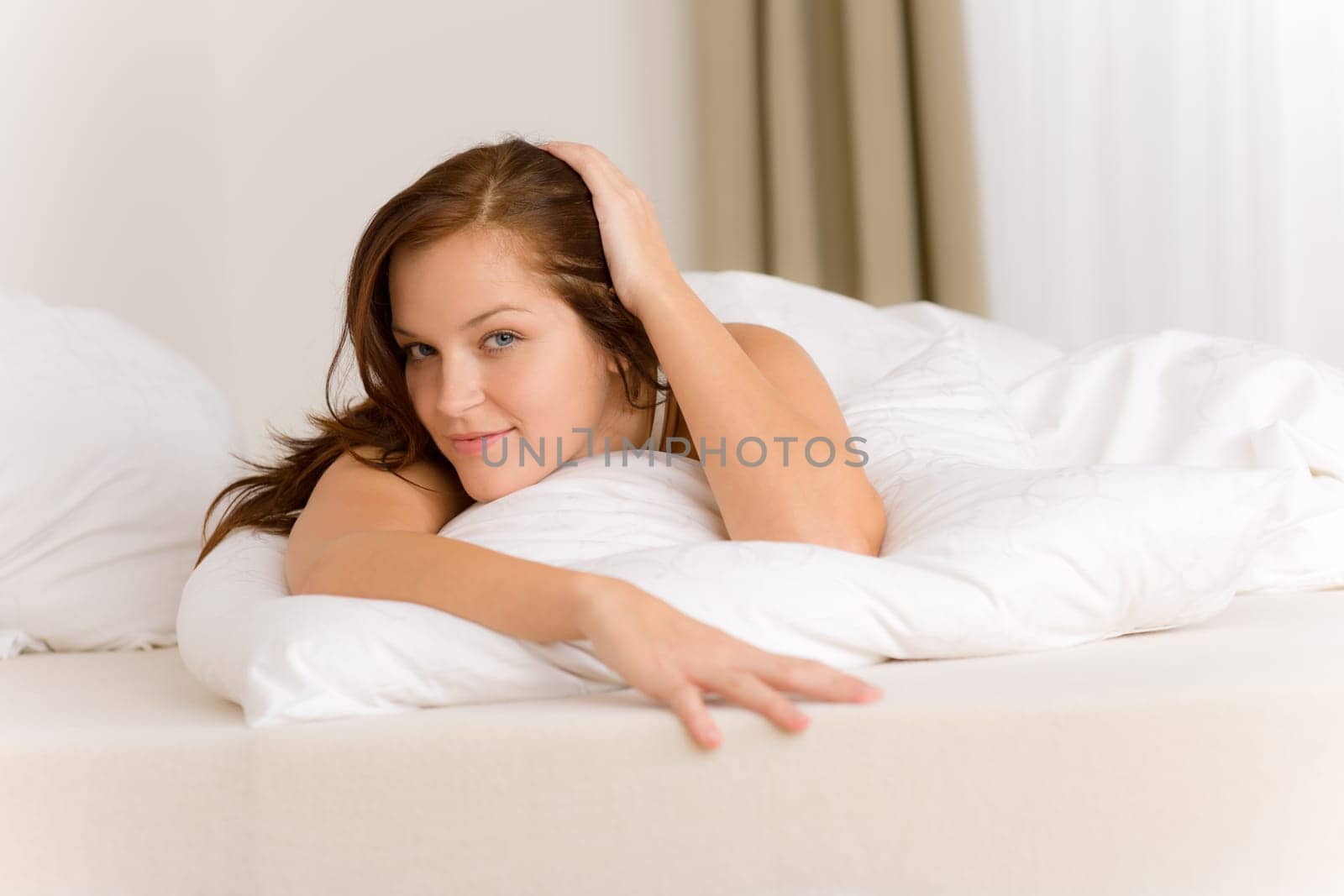 Bedroom - happy woman in white bed