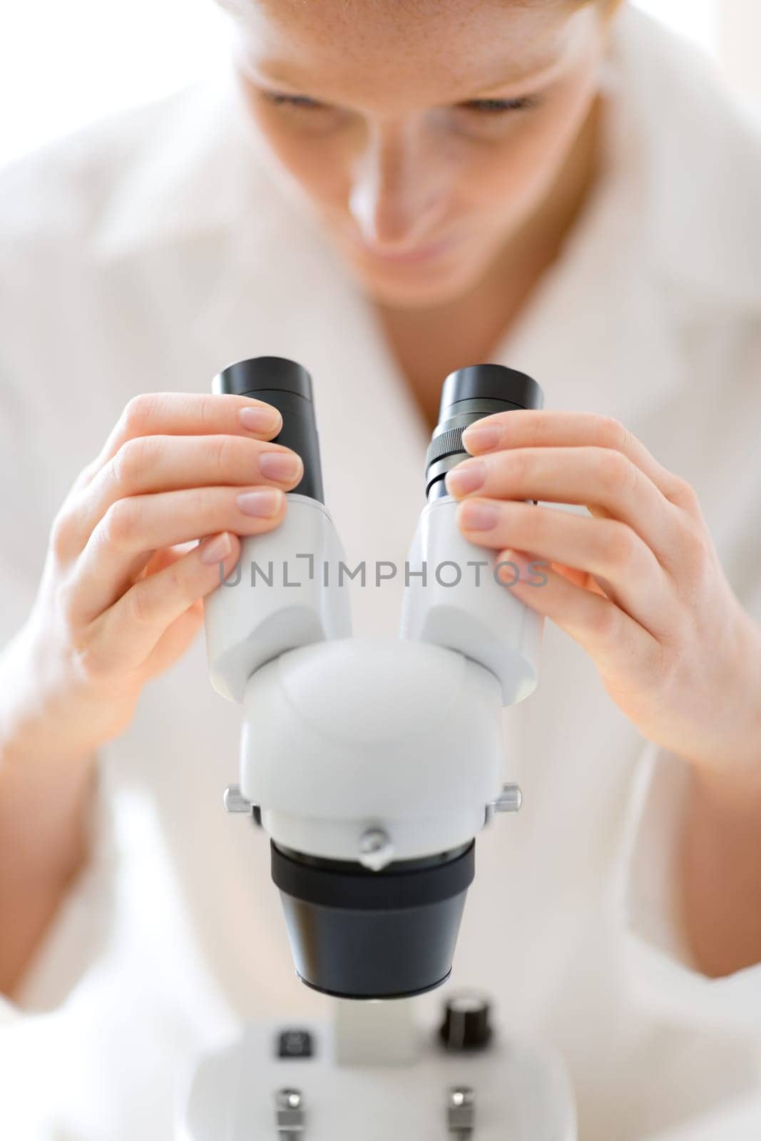 Microscope laboratory - woman medical research