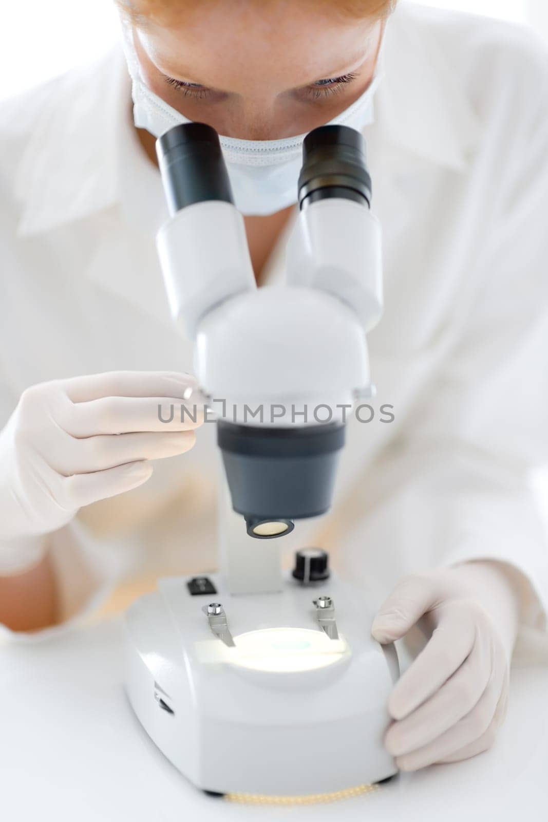 Microscope laboratory - woman medical research