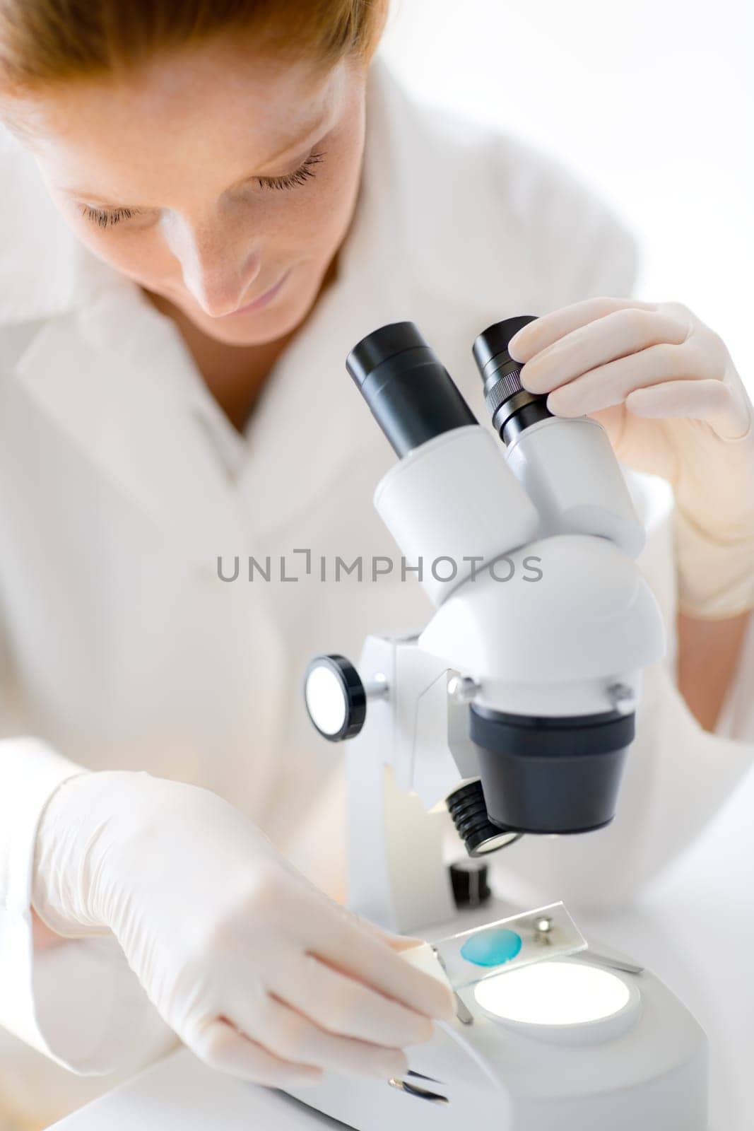 Microscope laboratory - woman medical research
