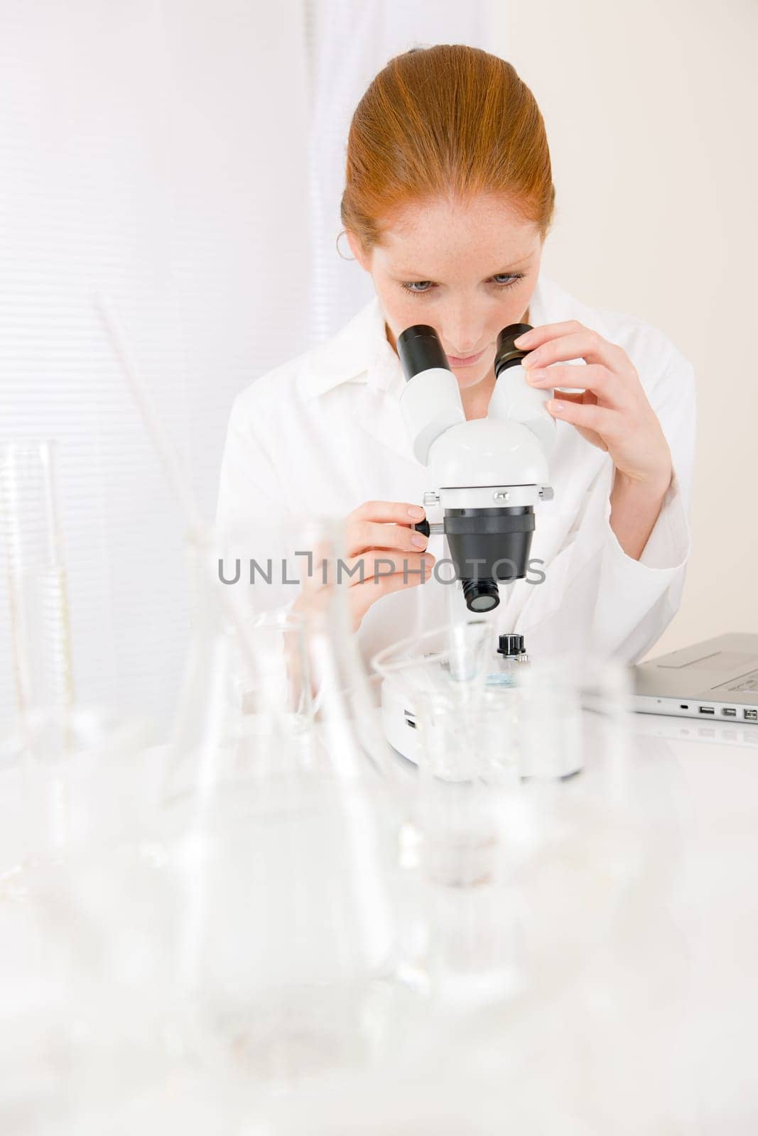 Microscope laboratory - woman medical research