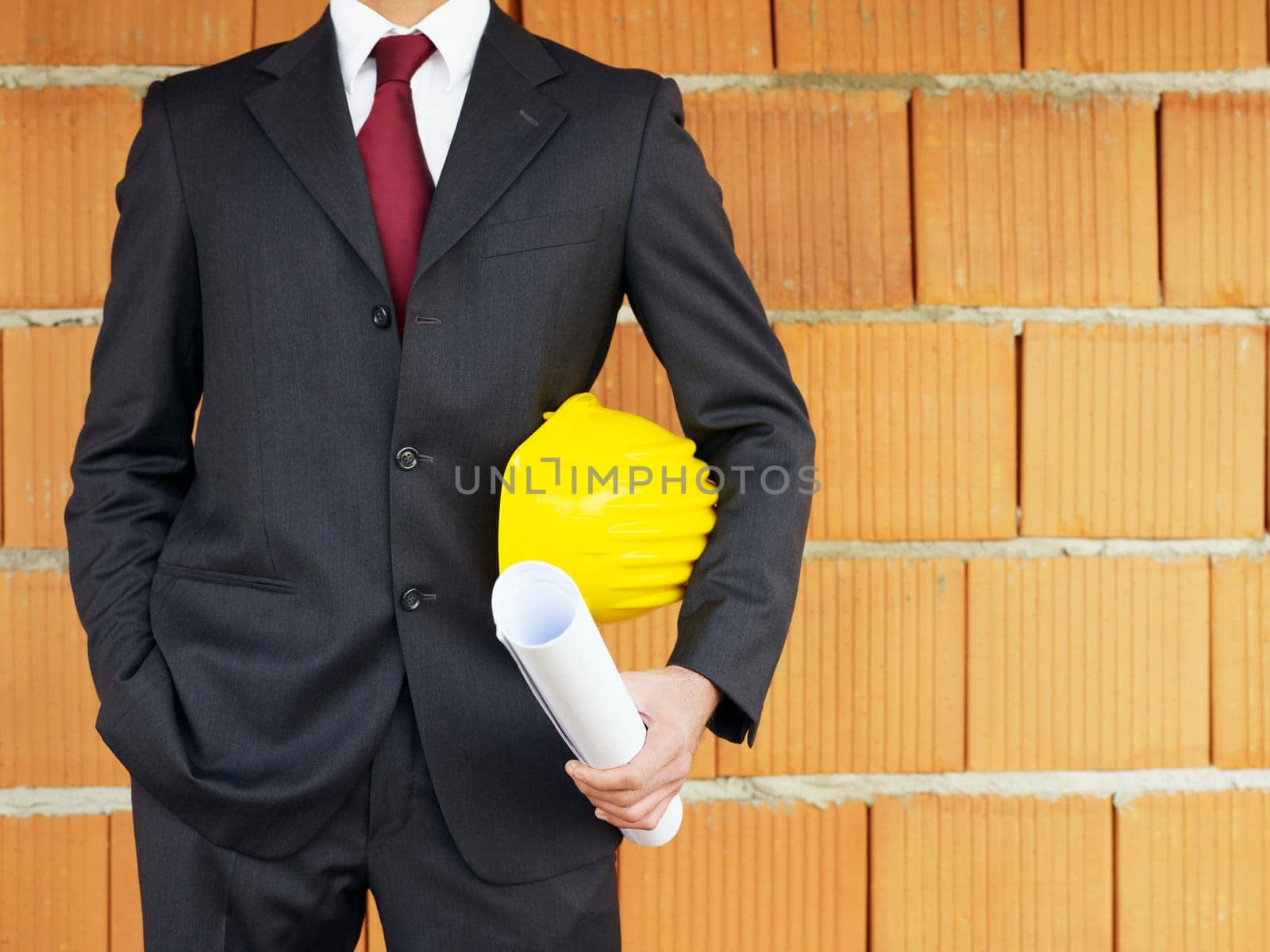 architect near red wall