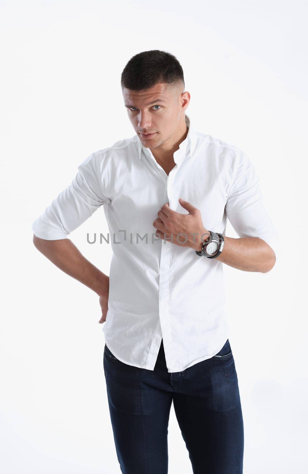 Young successful businessman on a white background in a shirt