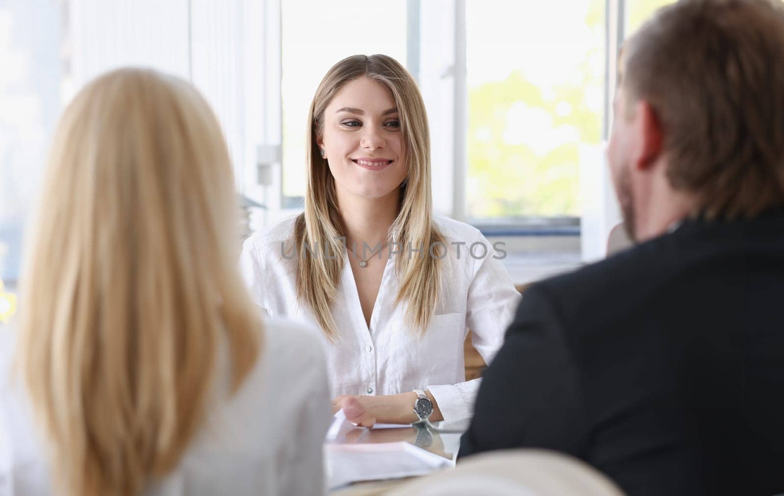 Young couple trying to get loan at bank clerk by kuprevich