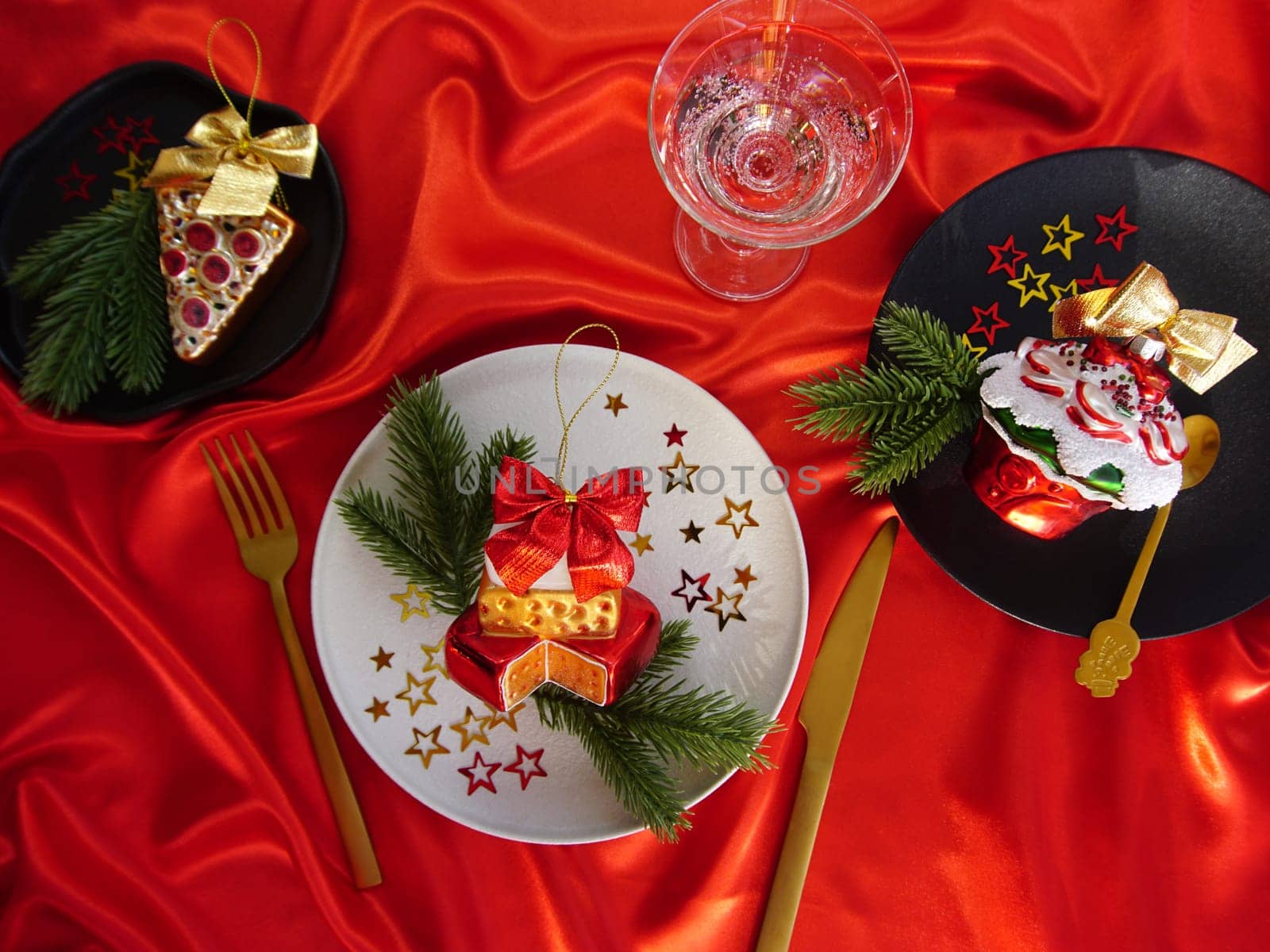 New Year's desserts. Creative table setting with Christmas tree toys. by Spirina
