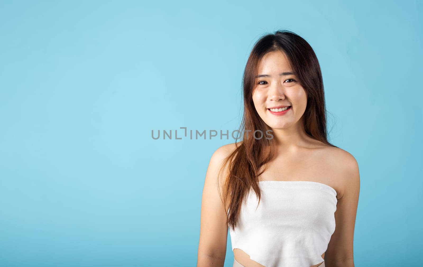 Skin care and Beauty concept. Asian young woman with beauty face touching healthy facial skin, portrait happy female with natural makeup and healthy face