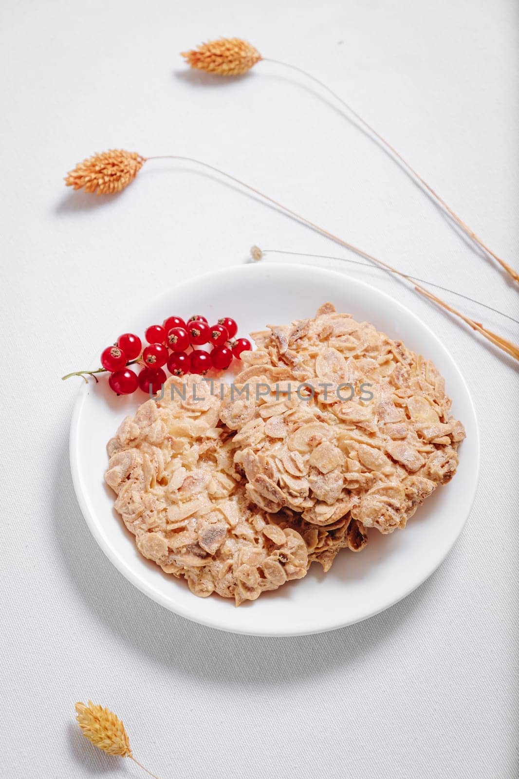 whole grain cookies with a sprig of red currants