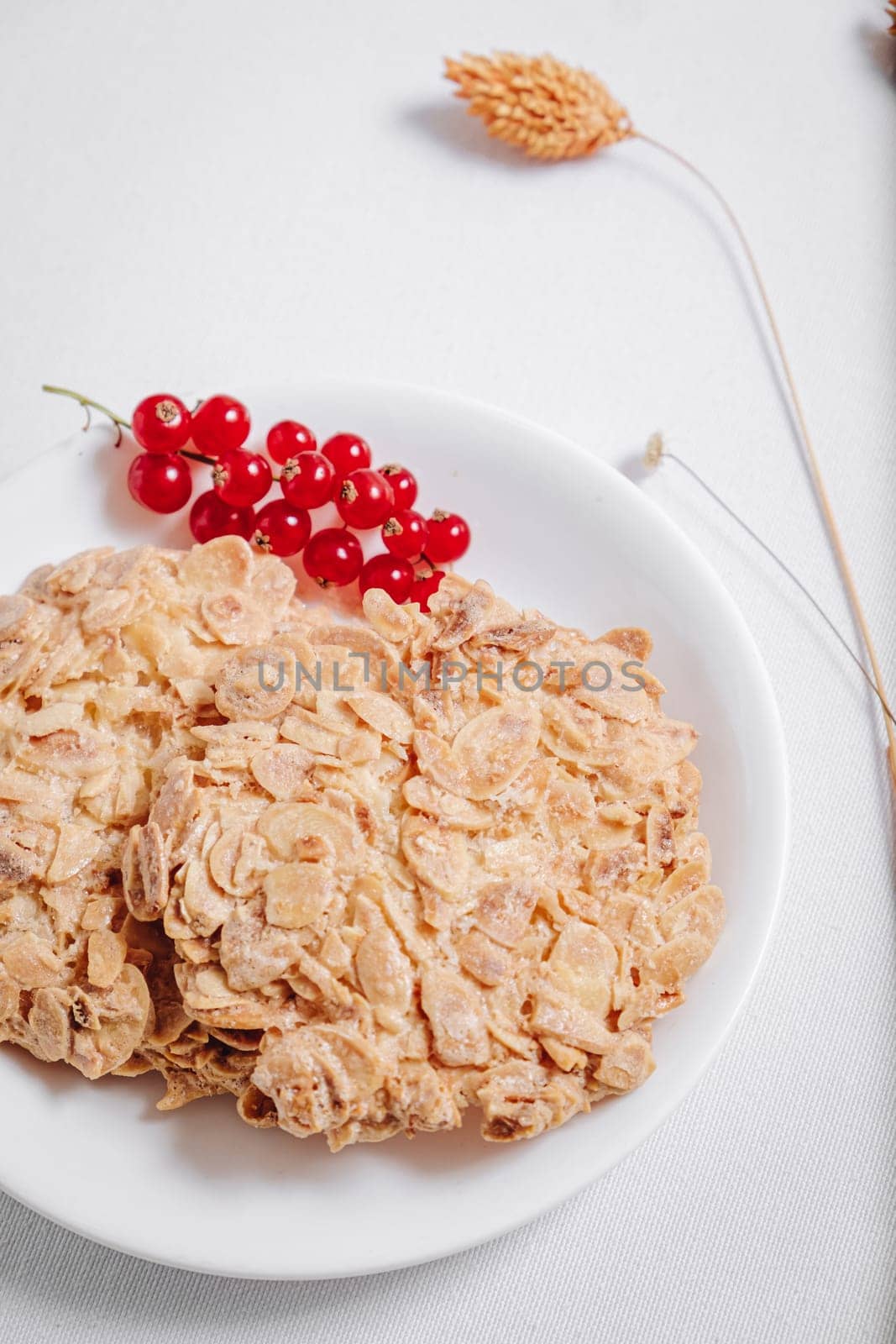 whole grain cookies with a sprig of red currants