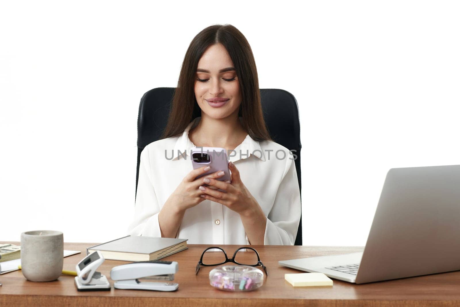 positive business woman using phone in the office