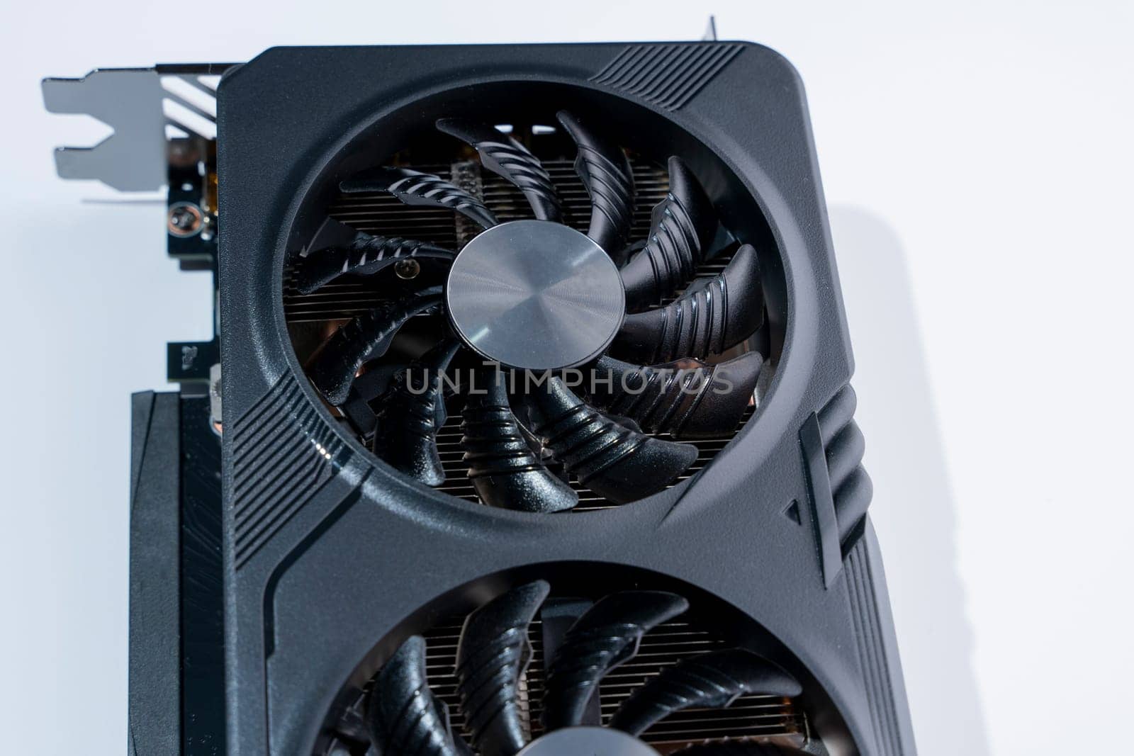 a modern powerful gaming graphics card for a computer with three fans. the concept of PC hardware. Gaming video card