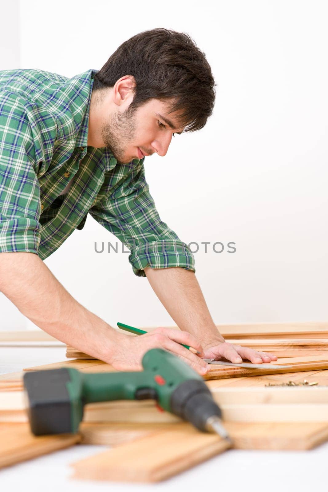 Home improvement - handyman installing wooden floor